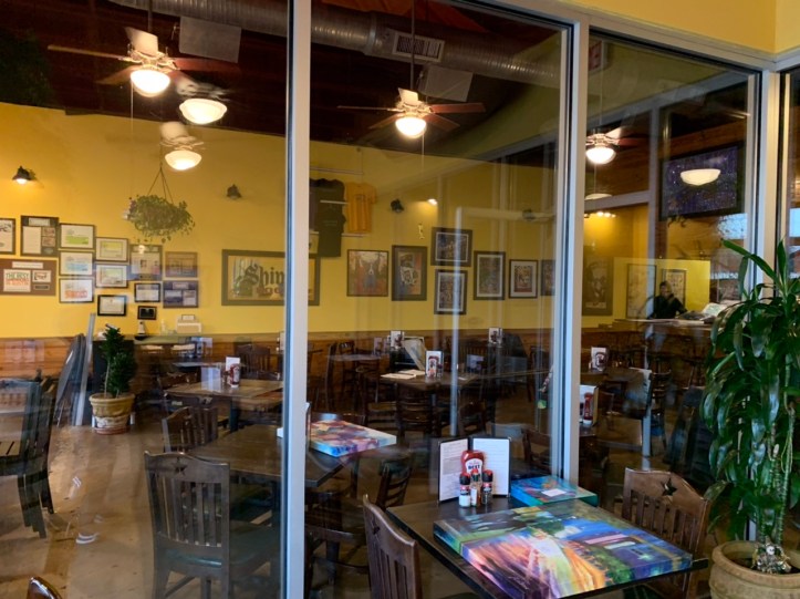 Delivering Art to Cypress Grill for Creative Arts Society Showing