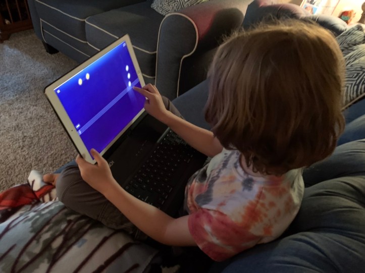 Max playing music on app on iPad March 2022 ©Felipe Adan Lerma Lerma