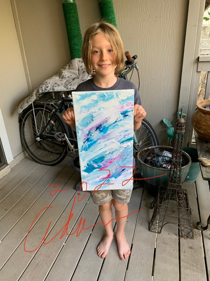 Preparing to sign the back of Mountains Clouds and Waves March 2022 ©Felipe Adan Lerma